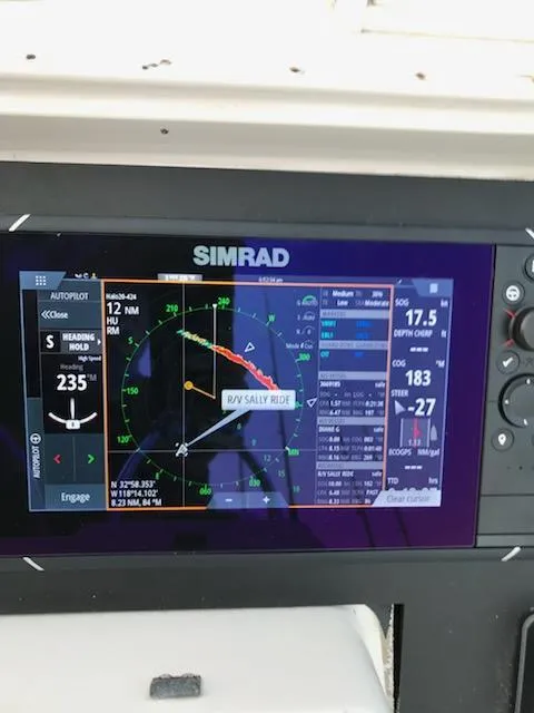 Slide: The Image of Simrad navigation display on 1991 Wellcraft 3300 Sport Bridge boat dashboard. - 16