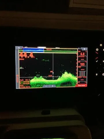 Slide: The Image of Fishfinder display on 1991 Wellcraft 3300 Sport Bridge, showing underwater terrain and depth. - 17