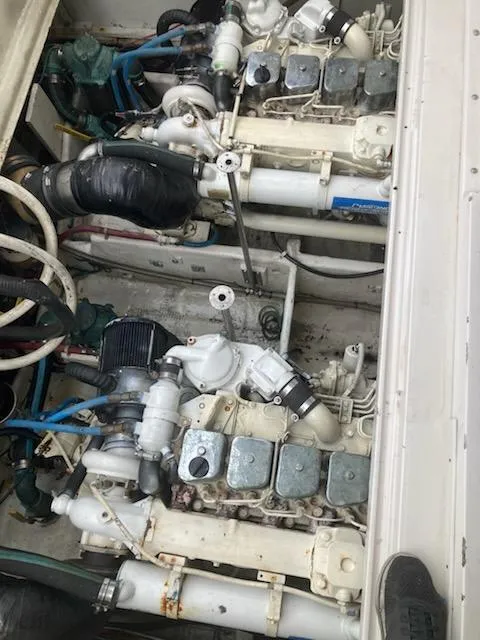 Slide: The Image of Engine compartment of a 1991 Wellcraft 3300 Sport Bridge boat, showcasing dual engines. - 34