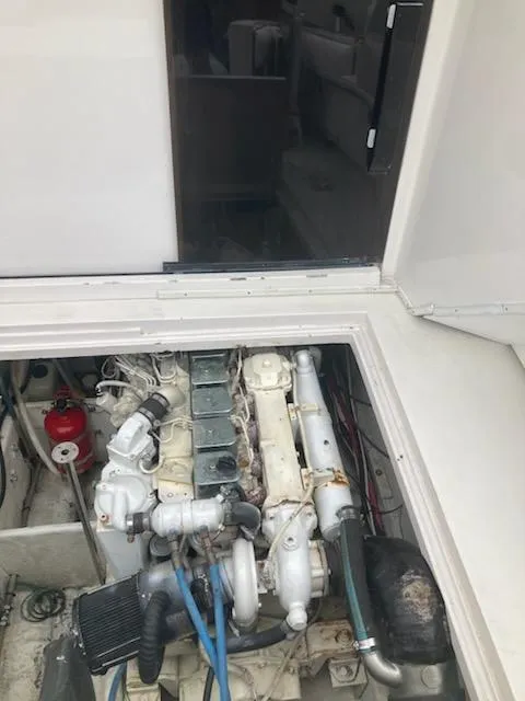 Slide: The Image of Engine compartment of a 1991 Wellcraft 3300 Sport Bridge boat. - 37