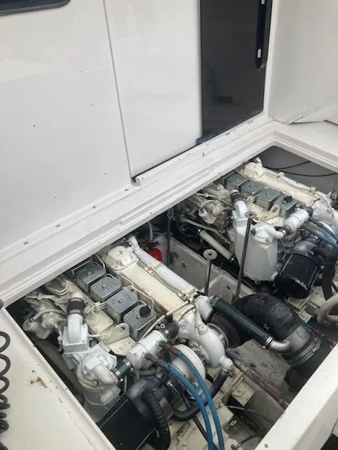 Slide: The Image of Engine compartment of a 1991 Wellcraft 3300 Sport Bridge boat, showcasing dual engines. - 39