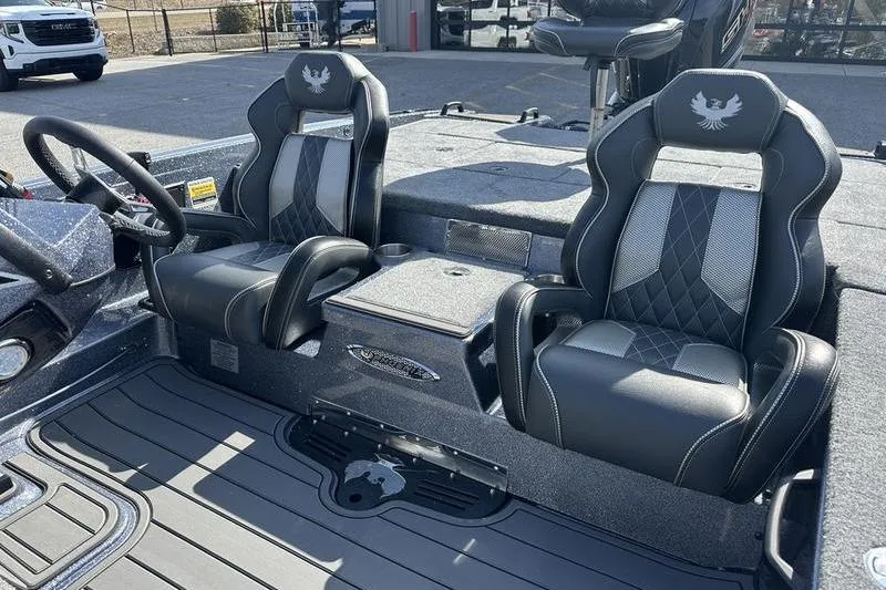 Slide: The Image of 2026 Phoenix 921 Elite X boat interior with luxurious black and gray seating. - 10