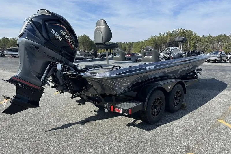 Slide: The Image of 2026 Phoenix 921 Elite X boat with Yamaha engine on trailer in parking lot. - 4
