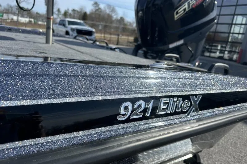 Slide: The Image of 2026 Phoenix 921 Elite X boat with glittering finish, close-up view. - 6