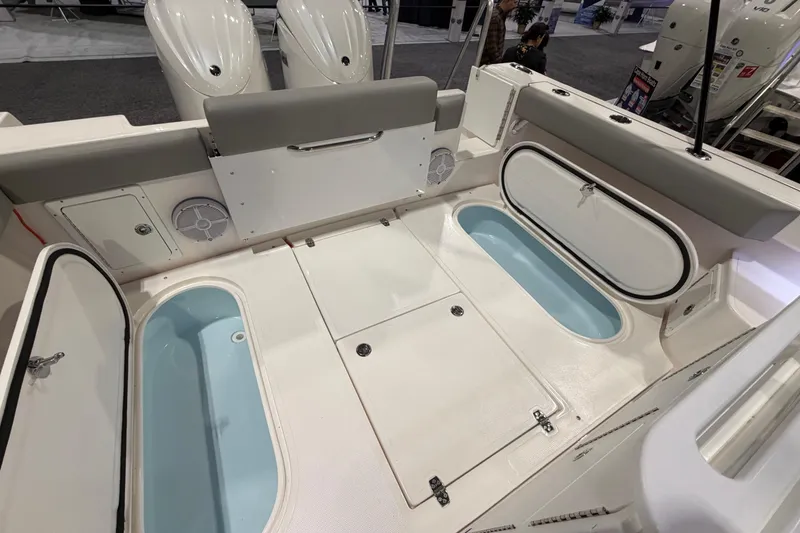 Slide: The Image of 2026 NorthCoast 255 Cabin boat interior with storage compartments and seating. - 4