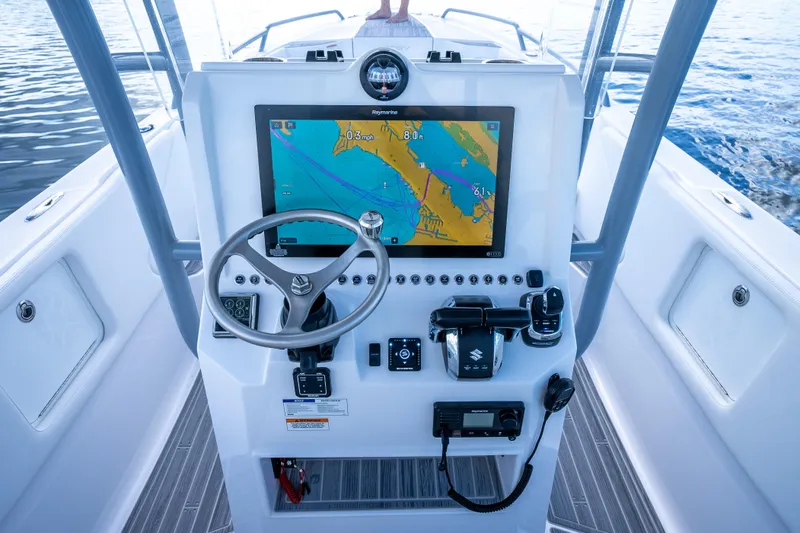 Slide: The Image of 2023 Dynamic D-305V boat dashboard with navigation display and controls on open water. - 10