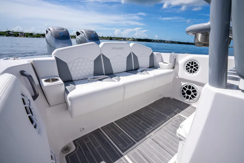 Slide: The Image of Luxury seating on 2023 Dynamic D-305V boat with ocean view and modern design. - 12