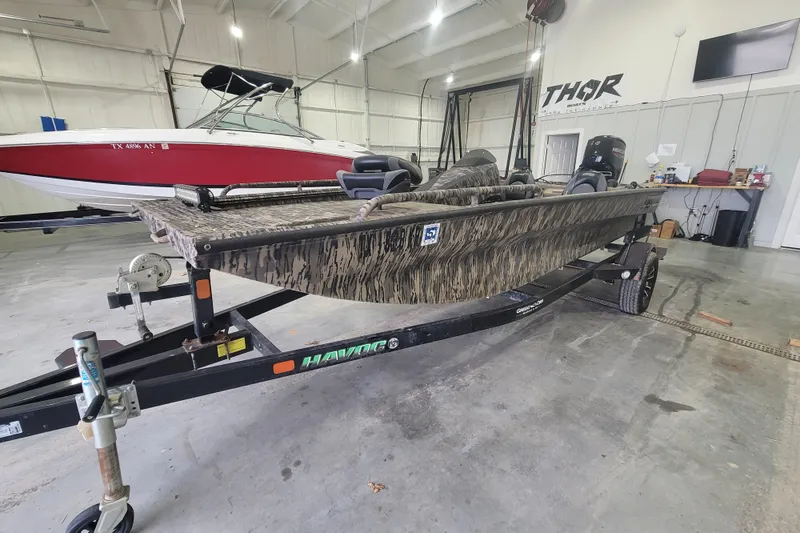 Slide: The Image of 2023 Havac FRRSC boat on trailer in indoor storage facility. - 4