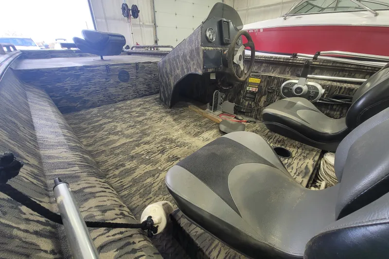 Slide: The Image of 2023 Havac FRRSC boat interior with camouflage design and modern steering console. - 8