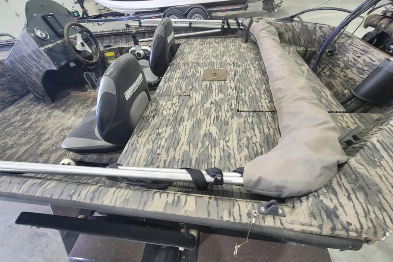 Slide: The Image of 2023 Havac FRRSC boat interior with camouflage design and dual seats. - 9