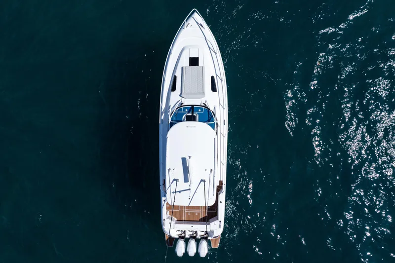 Slide: The Image of Overhead view of 2018 Intrepid 438 Evolution yacht on blue ocean water. - 10