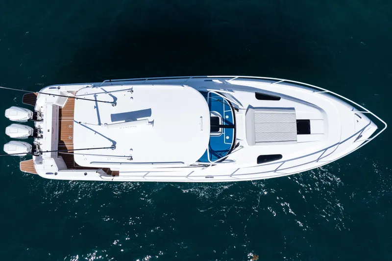Slide: The Image of Aerial view of 2018 Intrepid 438 Evolution yacht on blue water. - 12