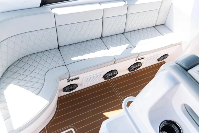 Slide: The Image of Luxurious seating on 2018 Intrepid 438 Evolution boat with quilted upholstery and teak flooring. - 15