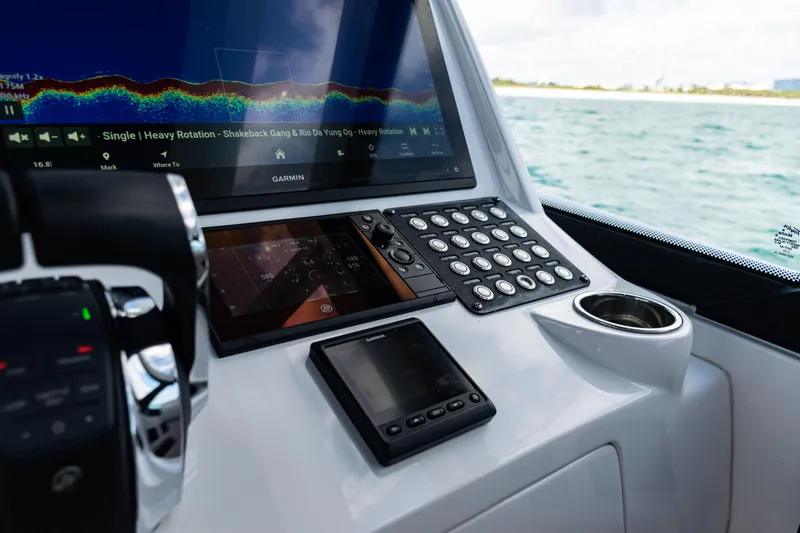 Slide: The Image of Cockpit of 2018 Intrepid 438 Evolution with Garmin navigation system and control panel. - 16