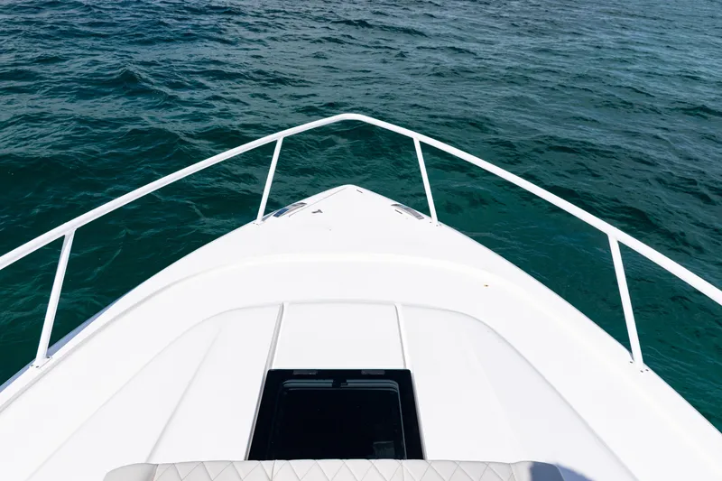 Slide: The Image of Bow view of 2018 Intrepid 438 Evolution yacht on open water. - 22