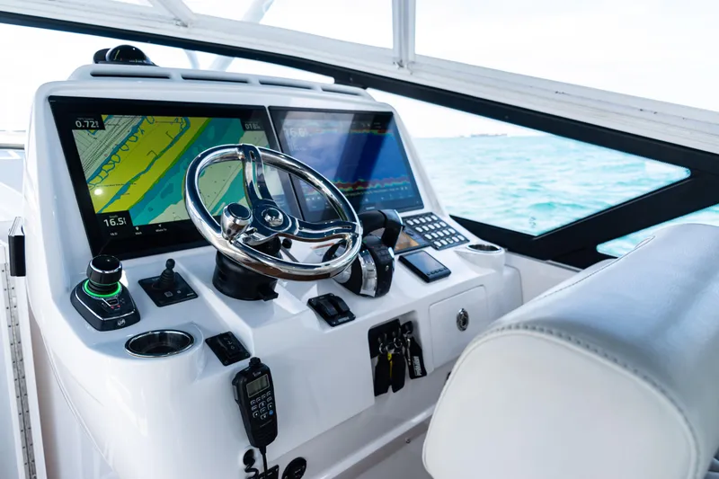 Slide: The Image of Cockpit of 2018 Intrepid 438 Evolution with advanced navigation displays and controls. - 38