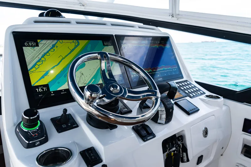 Slide: The Image of Cockpit of 2018 Intrepid 438 Evolution with advanced navigation displays and steering wheel. - 39