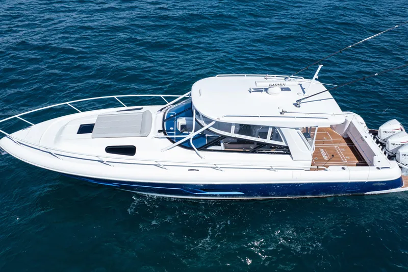 Slide: The Image of 2018 Intrepid 438 Evolution yacht cruising on open water, top view. - 4