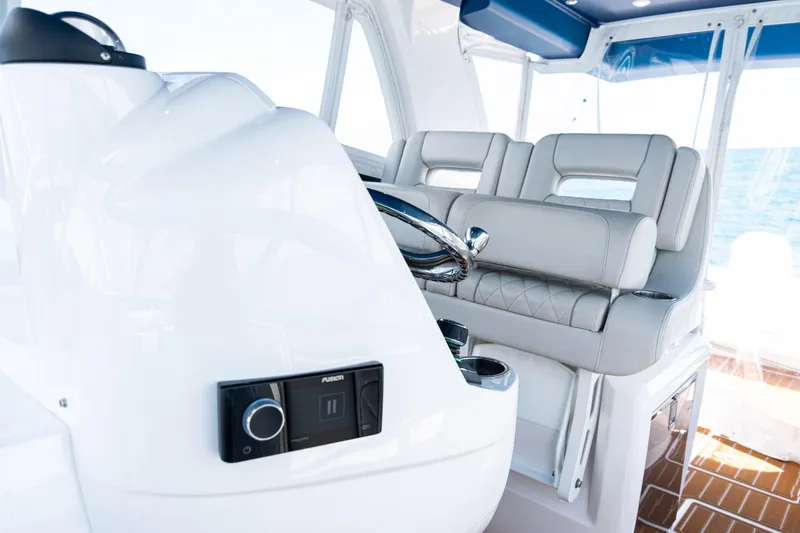 Slide: The Image of 2018 Intrepid 438 Evolution yacht interior with sleek helm and luxurious seating. - 40