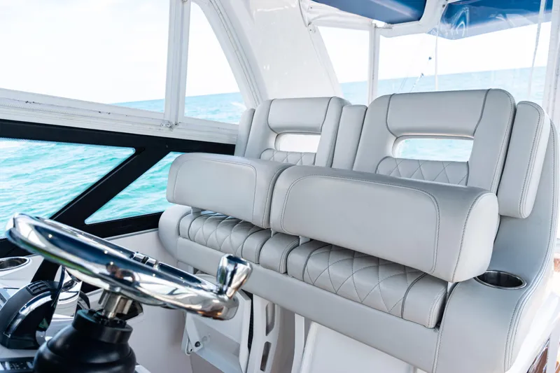 Slide: The Image of Luxurious interior of 2018 Intrepid 438 Evolution yacht with plush seating and steering wheel. - 41