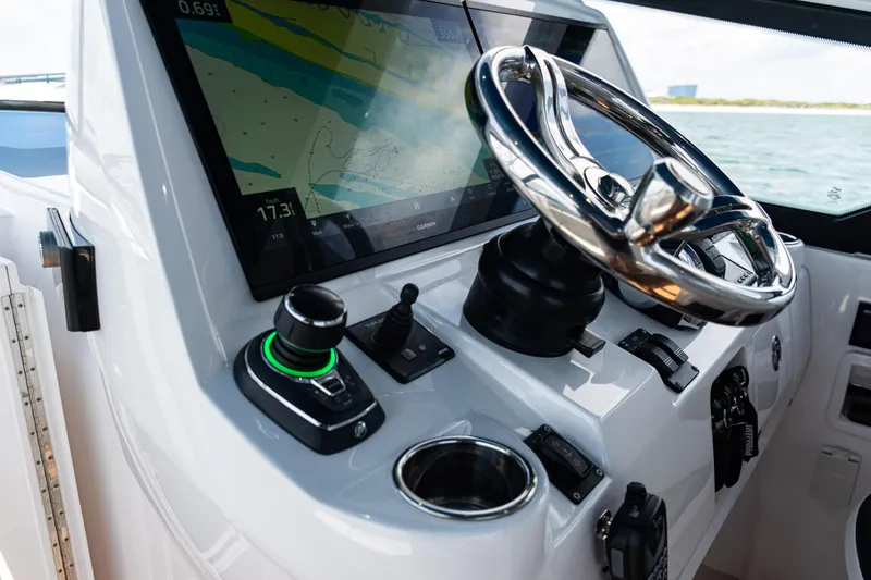 Slide: The Image of Cockpit of 2018 Intrepid 438 Evolution with steering wheel and navigation display. - 44