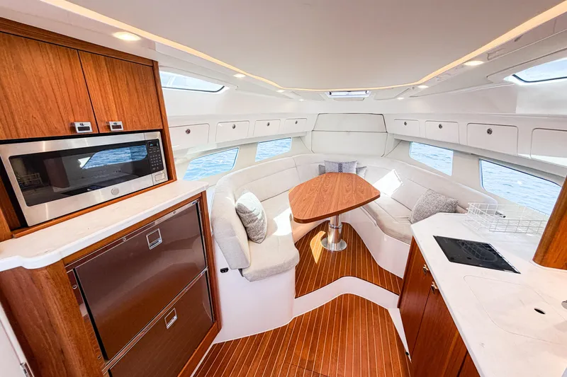 Slide: The Image of Luxurious interior of 2018 Intrepid 438 Evolution yacht with modern kitchen and seating area. - 47