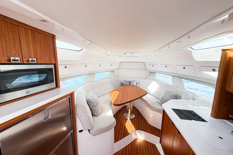 Slide: The Image of Luxurious interior of 2018 Intrepid 438 Evolution yacht with modern kitchen and seating area. - 50