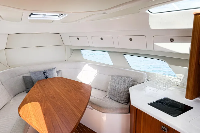 Slide: The Image of Luxurious interior of 2018 Intrepid 438 Evolution yacht with elegant seating and modern amenities. - 52