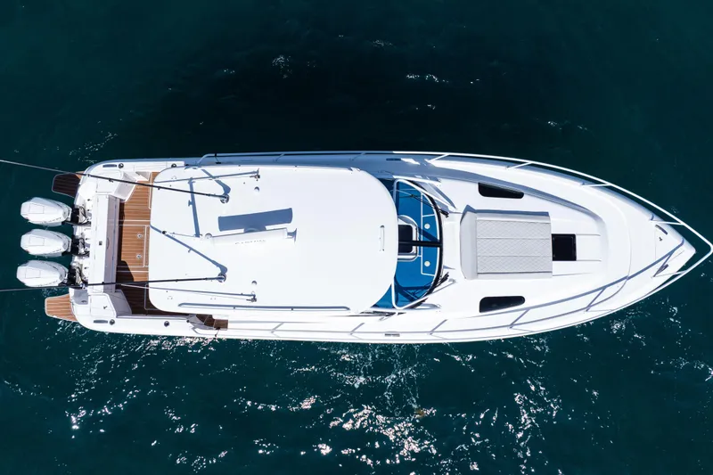 Slide: The Image of Overhead view of 2018 Intrepid 438 Evolution yacht on water. - 8