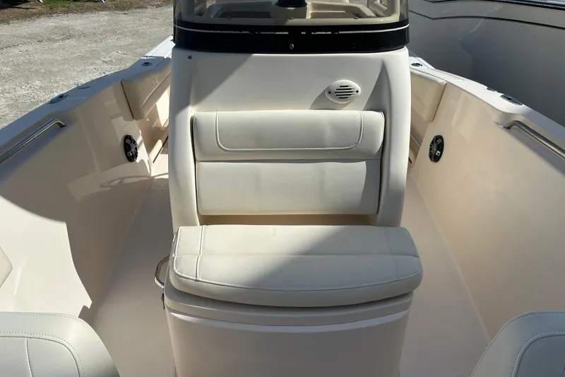Slide: The Image of 2020 Grady-White Fisherman 236 boat interior with cushioned seating and console. - 10