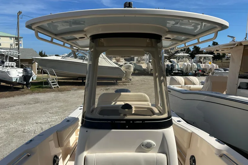 Slide: The Image of 2020 Grady-White Fisherman 236 boat with T-top, parked in a marina. - 11