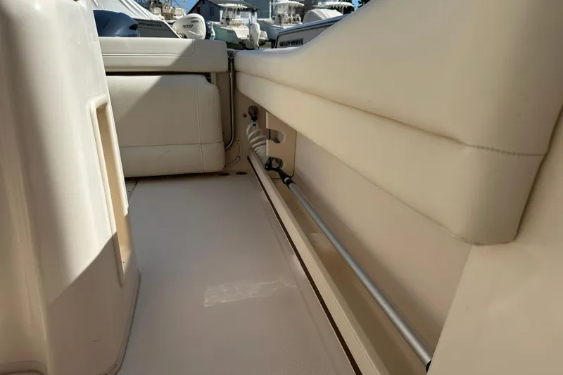 Slide: The Image of Interior view of a 2020 Grady-White Fisherman 236 boat, showcasing seating and storage. - 12