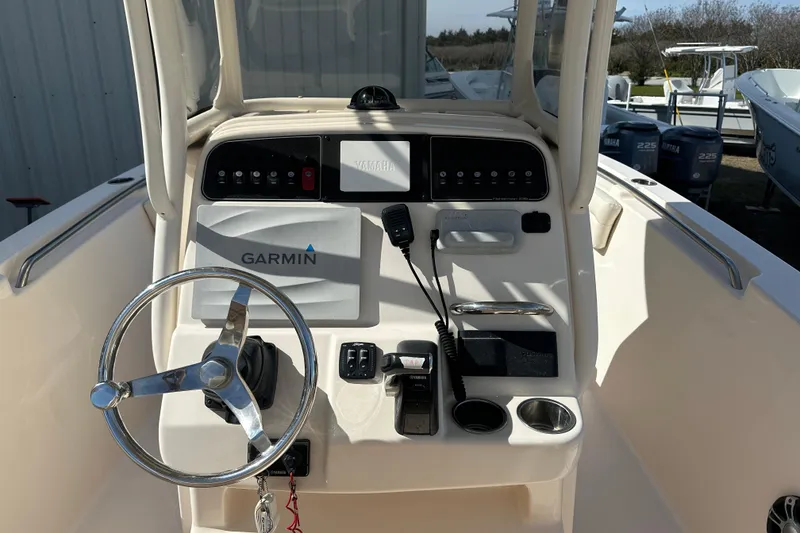 Slide: The Image of 2020 Grady-White Fisherman 236 boat console with Garmin navigation system and steering wheel. - 14