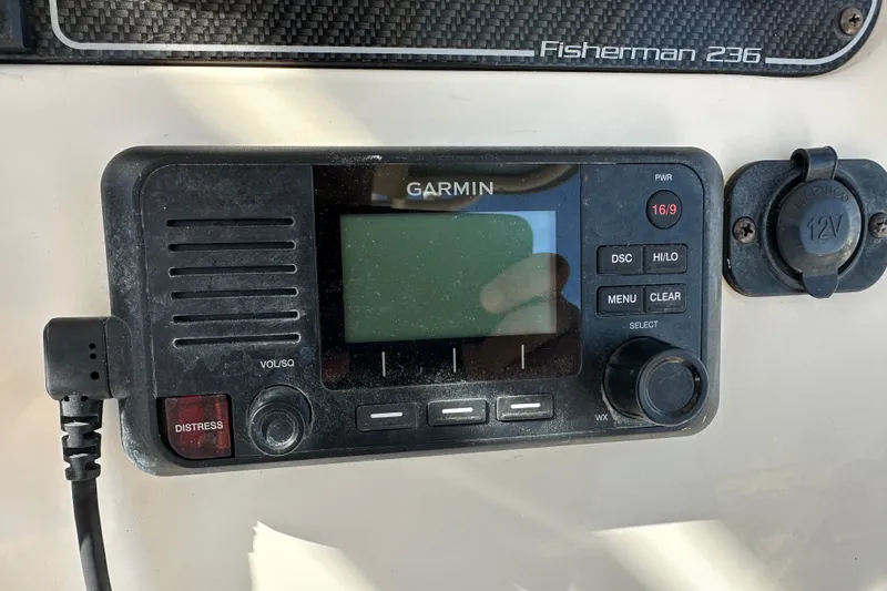 Slide: The Image of Garmin marine radio on 2020 Grady-White Fisherman 236 boat dashboard. - 16