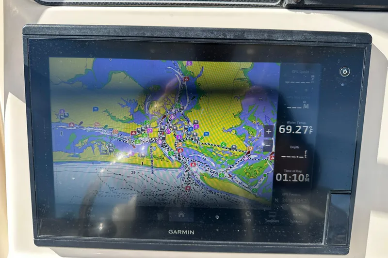Slide: The Image of Garmin navigation display on 2020 Grady-White Fisherman 236, showing detailed marine map. - 21