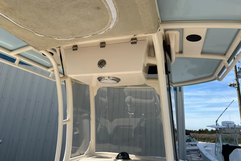 Slide: The Image of 2020 Grady-White Fisherman 236 boat console with overhead storage and canopy. - 22