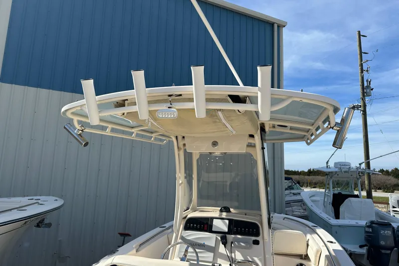 Slide: The Image of 2020 Grady-White Fisherman 236 boat with rod holders and navigation equipment. - 23