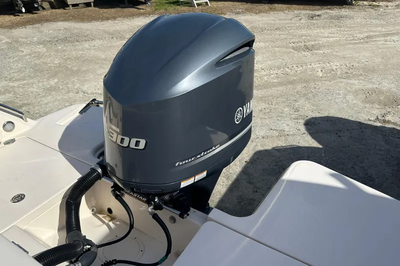 Slide: The Image of 2020 Grady-White Fisherman 236 with Yamaha 300 outboard motor, parked on gravel. - 28