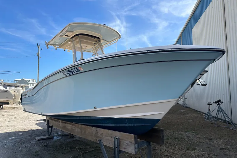 Slide: The Image of 2020 Grady-White Fisherman 236 boat on display outdoors under blue sky. - 3