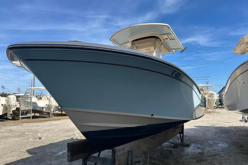 Slide: The Image of 2020 Grady-White Fisherman 236 boat on display under clear blue sky. - 5