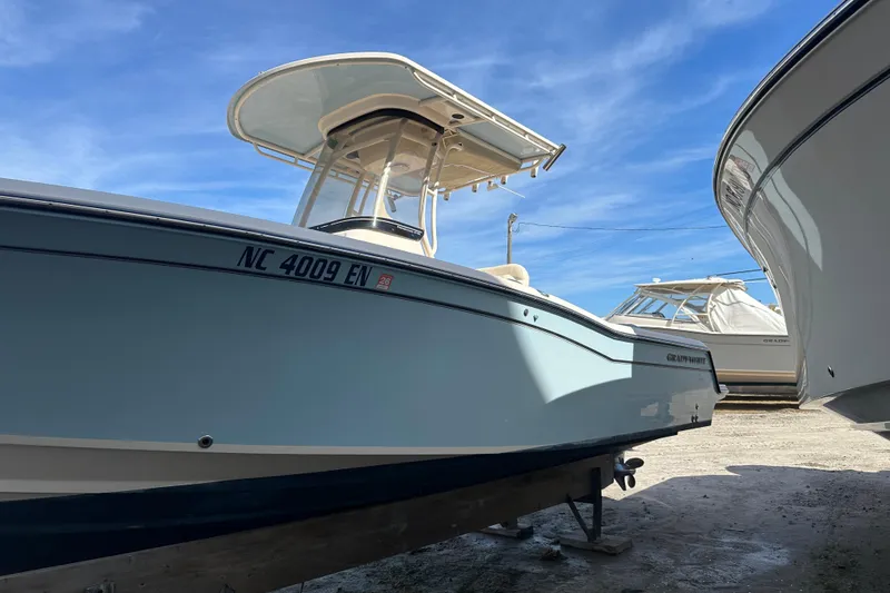 Slide: The Image of 2020 Grady-White Fisherman 236 boat with Yamaha engine, displayed outdoors. - 6