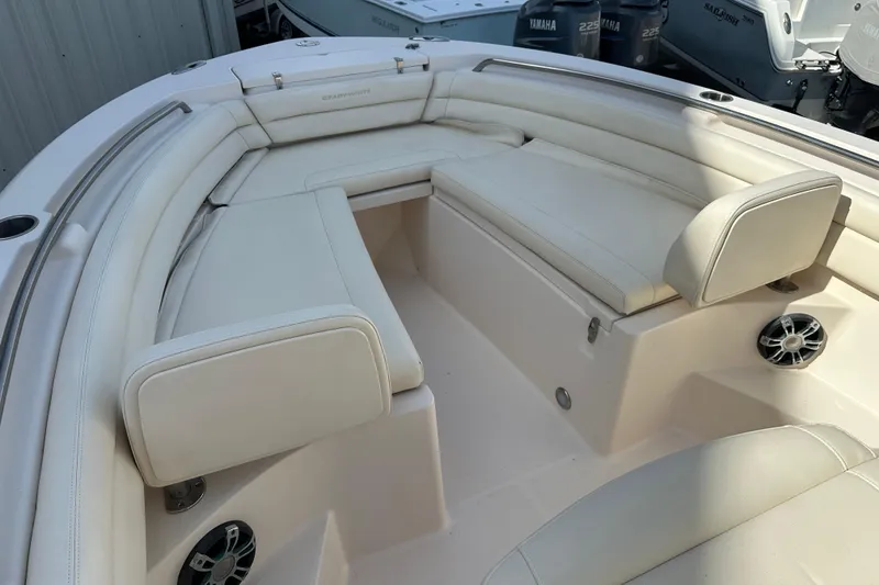 Slide: The Image of 2020 Grady-White Fisherman 236 boat interior with cushioned seating and speakers. - 9