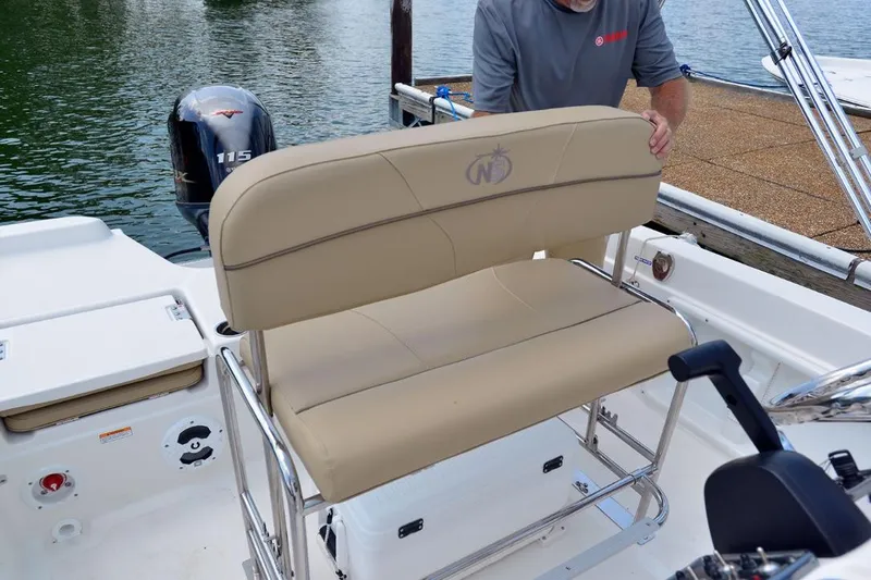 Slide: The Image of Manufacturer Provided Image: 2021 NauticStar 211 Hybrid boat with tan seating and Yamaha 115 outboard motor. - 12