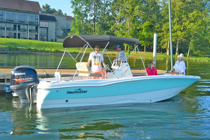 Slide: The Image of Manufacturer Provided Image: 2021 NauticStar 211 Hybrid boat on a lake with people onboard. - 3