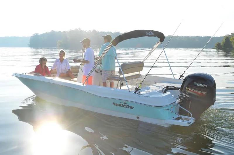 Slide: The Image of Manufacturer Provided Image: 2021 NauticStar 211 Hybrid boat on a lake with people fishing. - 4
