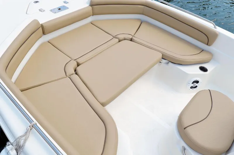 Slide: The Image of Manufacturer Provided Image: 2021 NauticStar 211 Hybrid boat with tan cushioned seating area. - 7