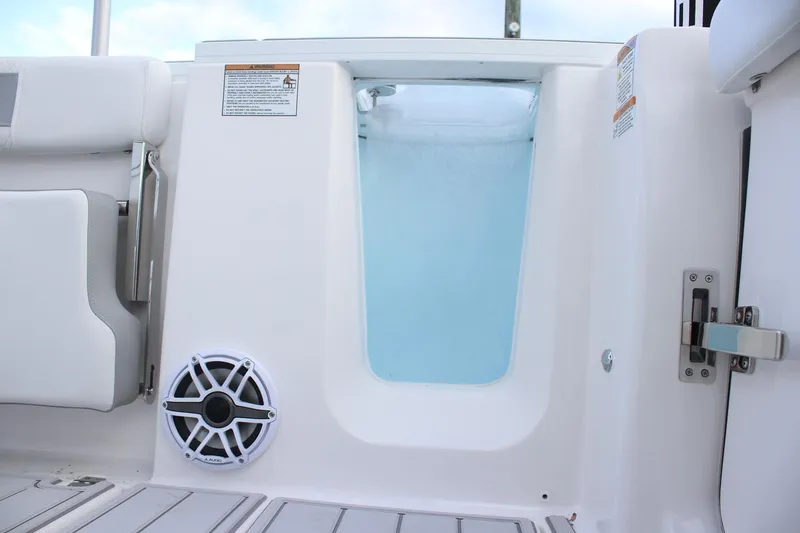 Slide: The Image of 2026 Sea Fox 288 Commander boat interior with speaker and storage compartment. - 10