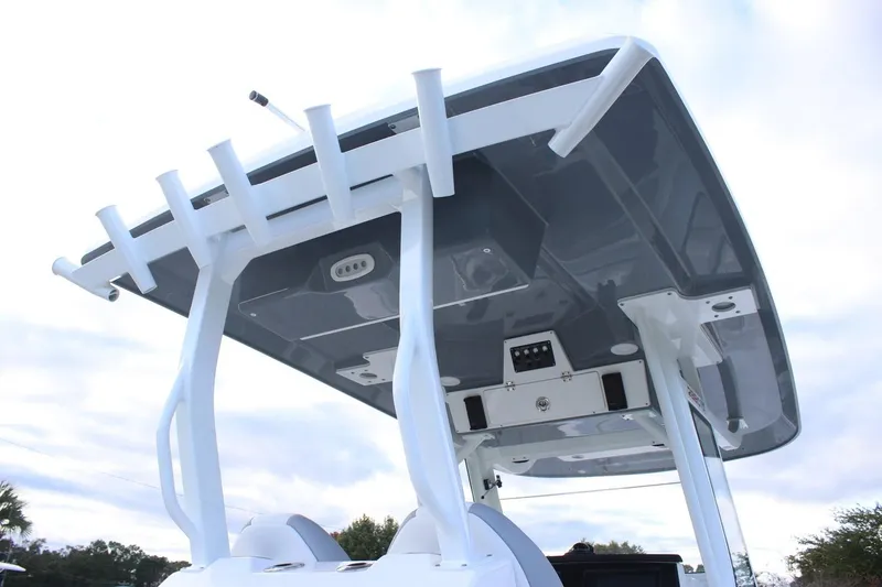 Slide: The Image of 2026 Sea Fox 288 Commander boat's T-top with rod holders and electronics. - 6
