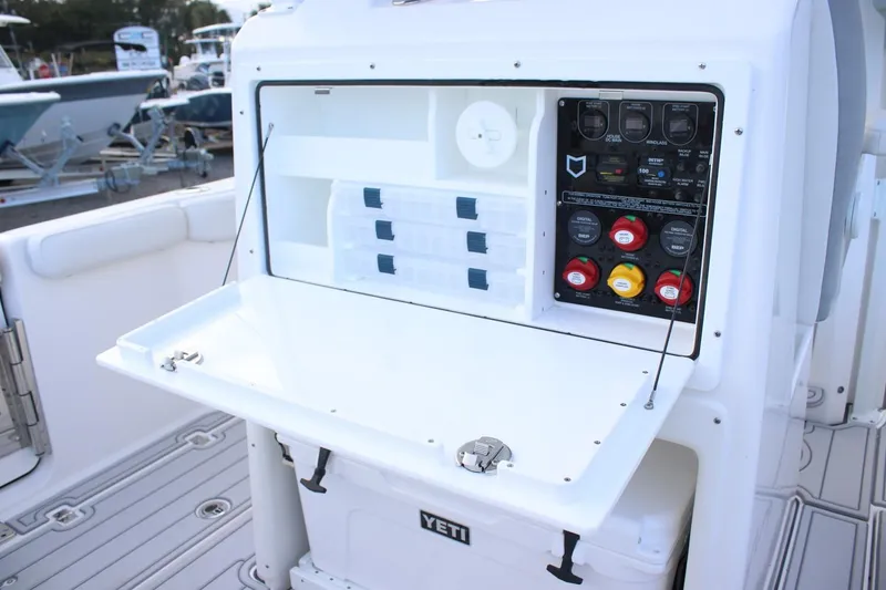 Slide: The Image of 2026 Sea Fox 288 Commander boat console with storage and control panel. - 8