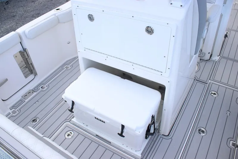Slide: The Image of 2026 Sea Fox 288 Commander boat interior with storage and cooler on deck. - 9